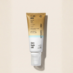 Tube of seventy-one Dry Sun Oil on a beige background