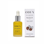 ODEN noisette facial oil bottle with dropper and packaging on a white background