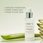 ODEN serum bottle with aloe vera leaves on a light green background