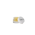 Small jar of cream with a white lid on a white background