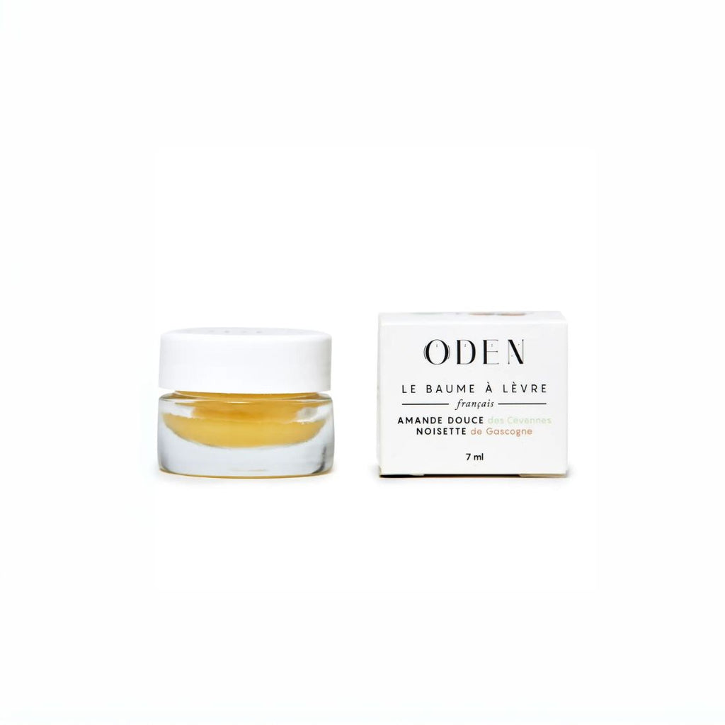 Oden Lip balm jar with its packaging on a white background