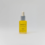 Yellow bottle of Oden Cerise on a white background