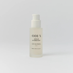 Skincare serum bottle labeled 'ODEN on a light gray background