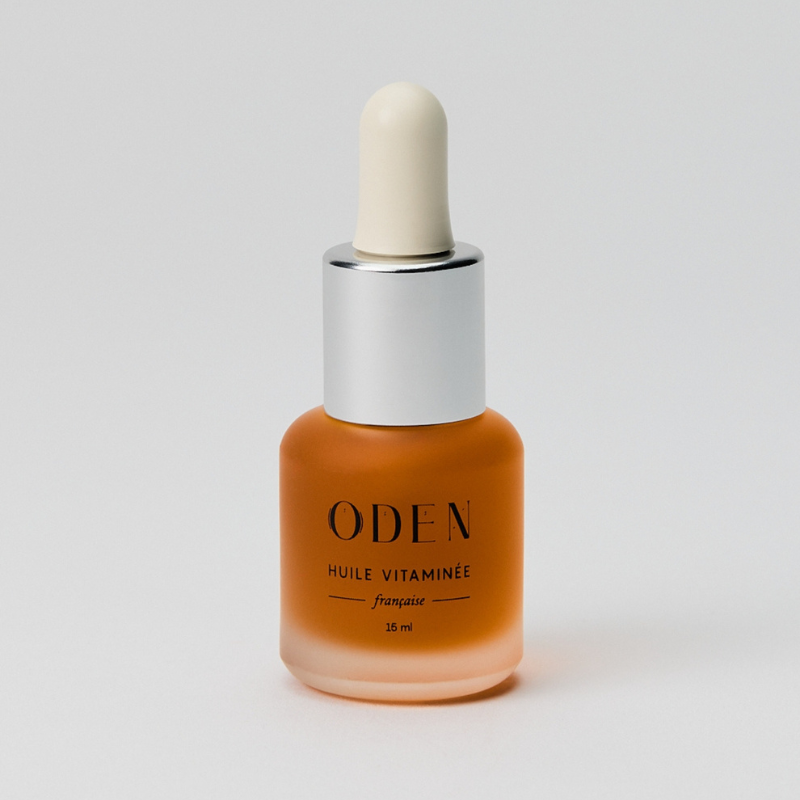 Brown dropper bottle with 'ODEN' branding on a light gray background